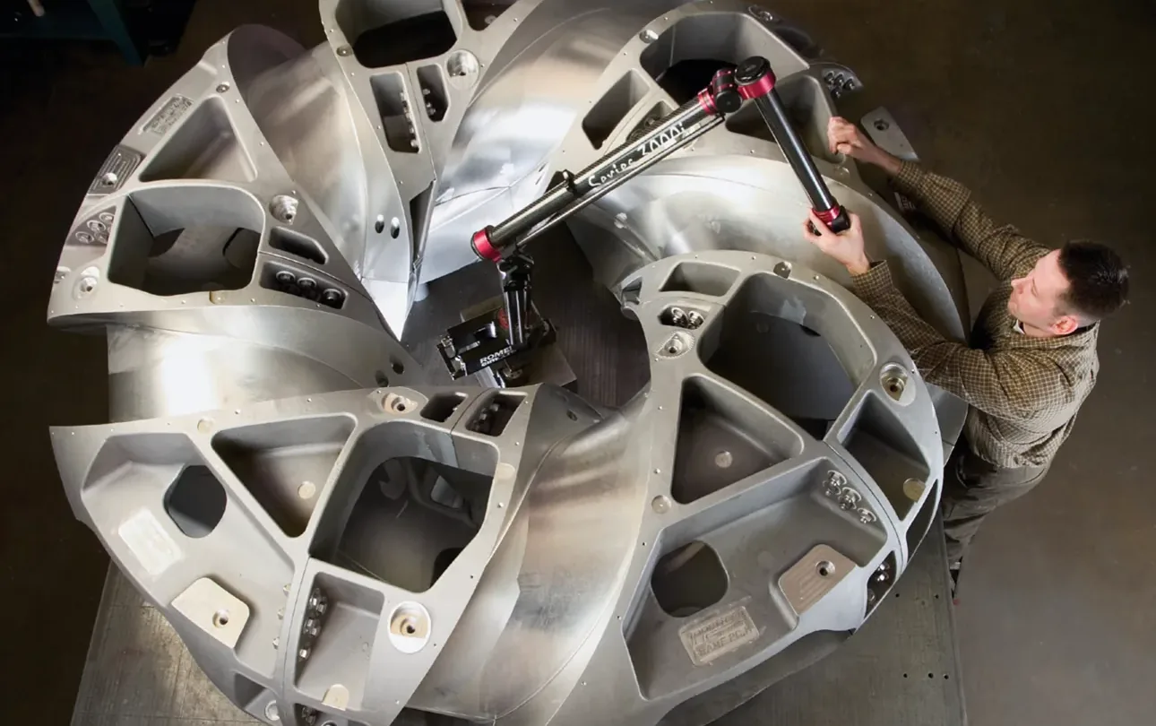 Five-axis machined impeller being inspected on the shop floor