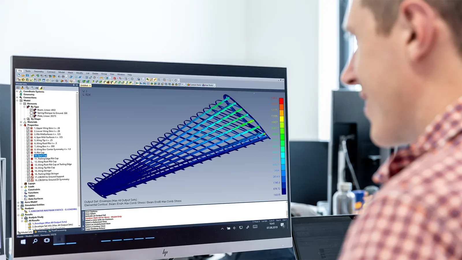 Engineer reviewing a Simcenter 3D structural result on the desktop